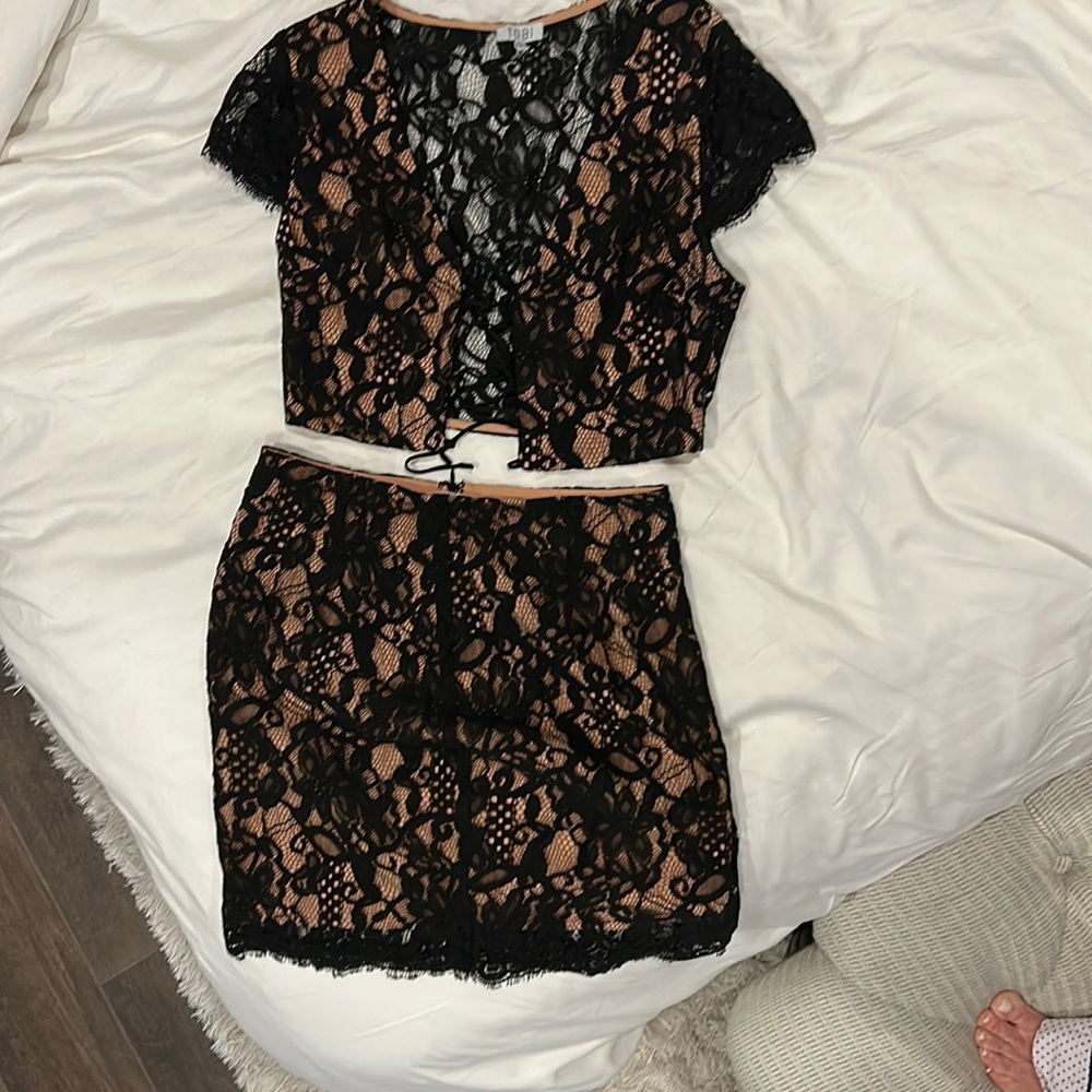 Two piece lace skirt, and shirt. Tan underlay.